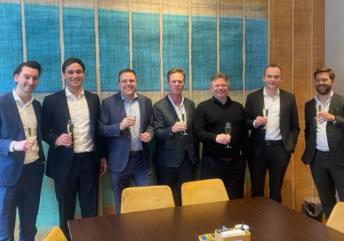 team of Fortes, Qics and Main toasting to the merger